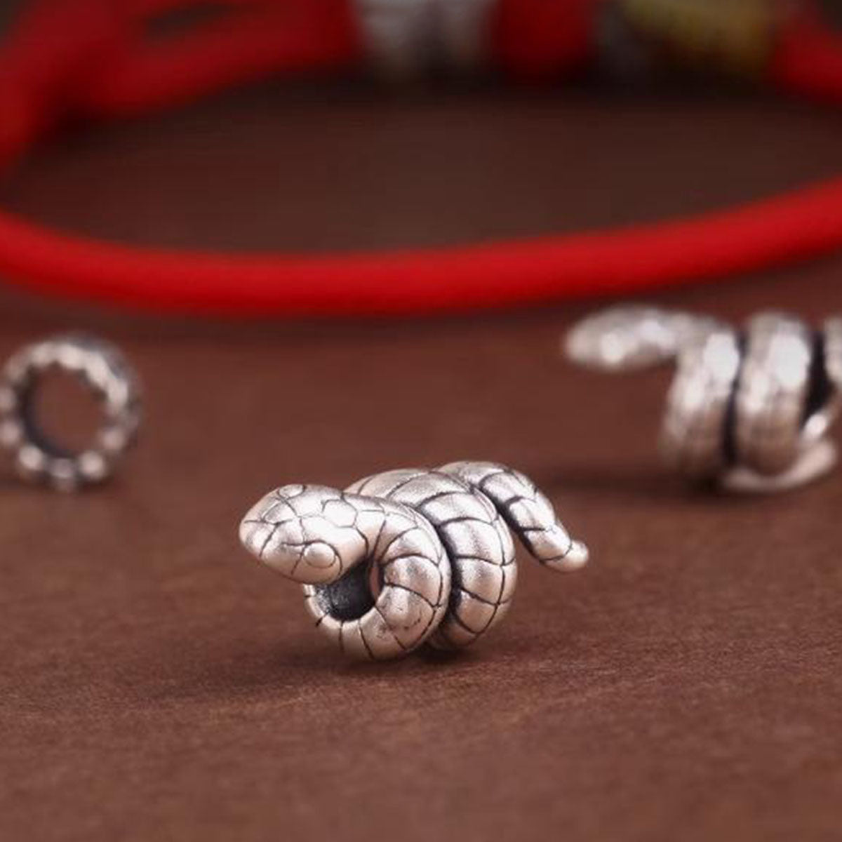 Snake Charm Bracelet - Red/Black Cord | Minimalist & Symbolic Hand Jewelry