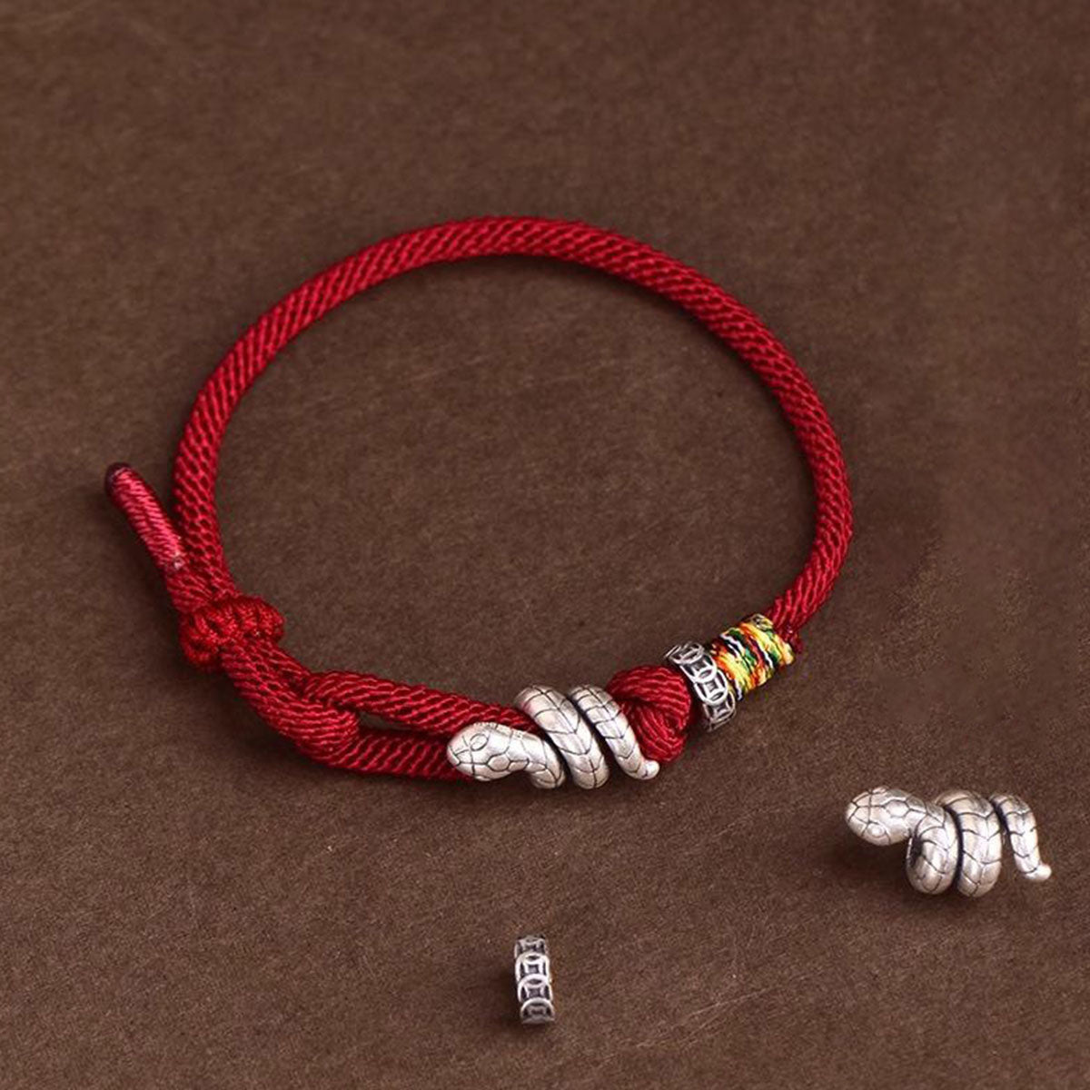 Snake Charm Bracelet - Red/Black Cord | Minimalist & Symbolic Hand Jewelry