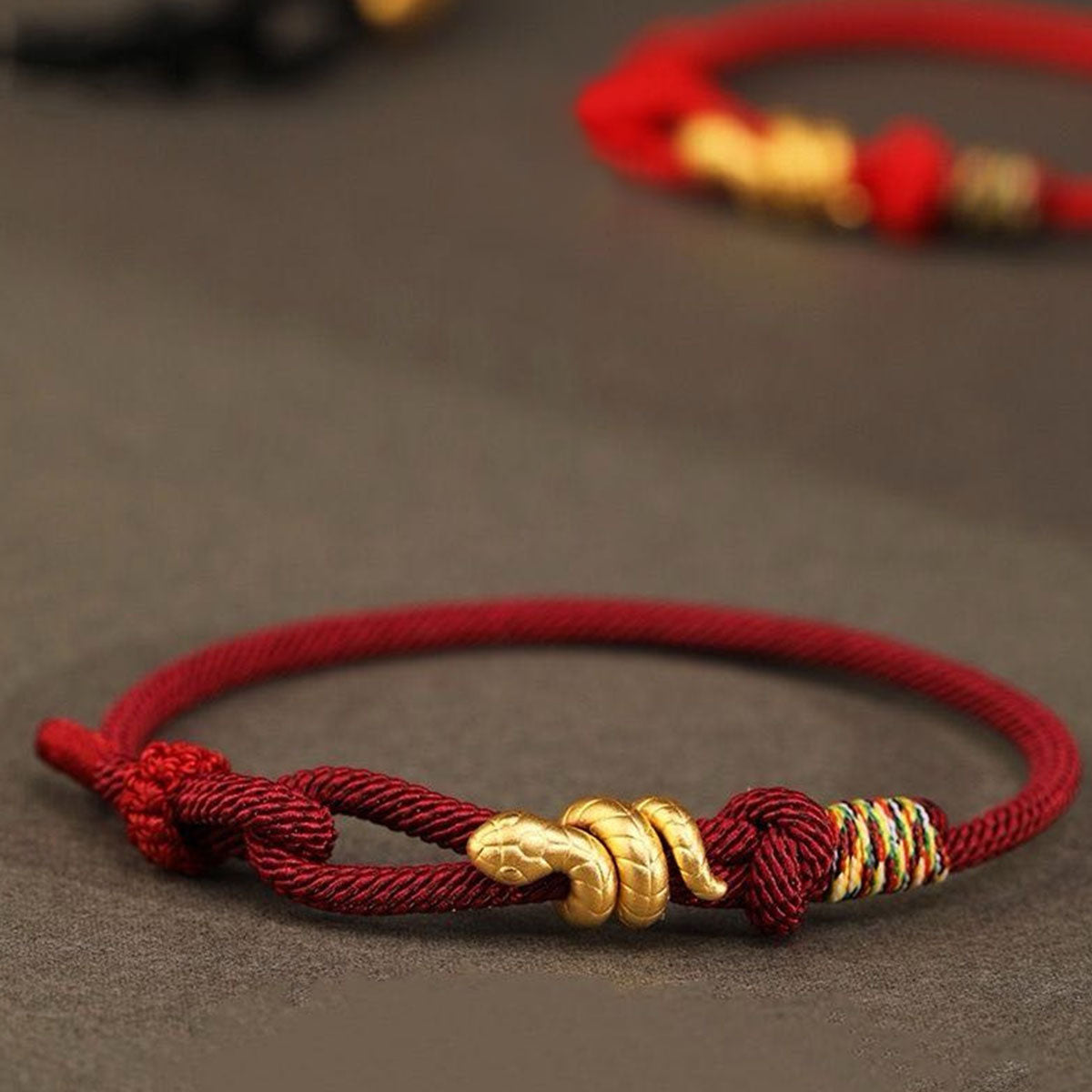 Snake Charm Bracelet - Red/Black Cord | Minimalist & Symbolic Hand Jewelry